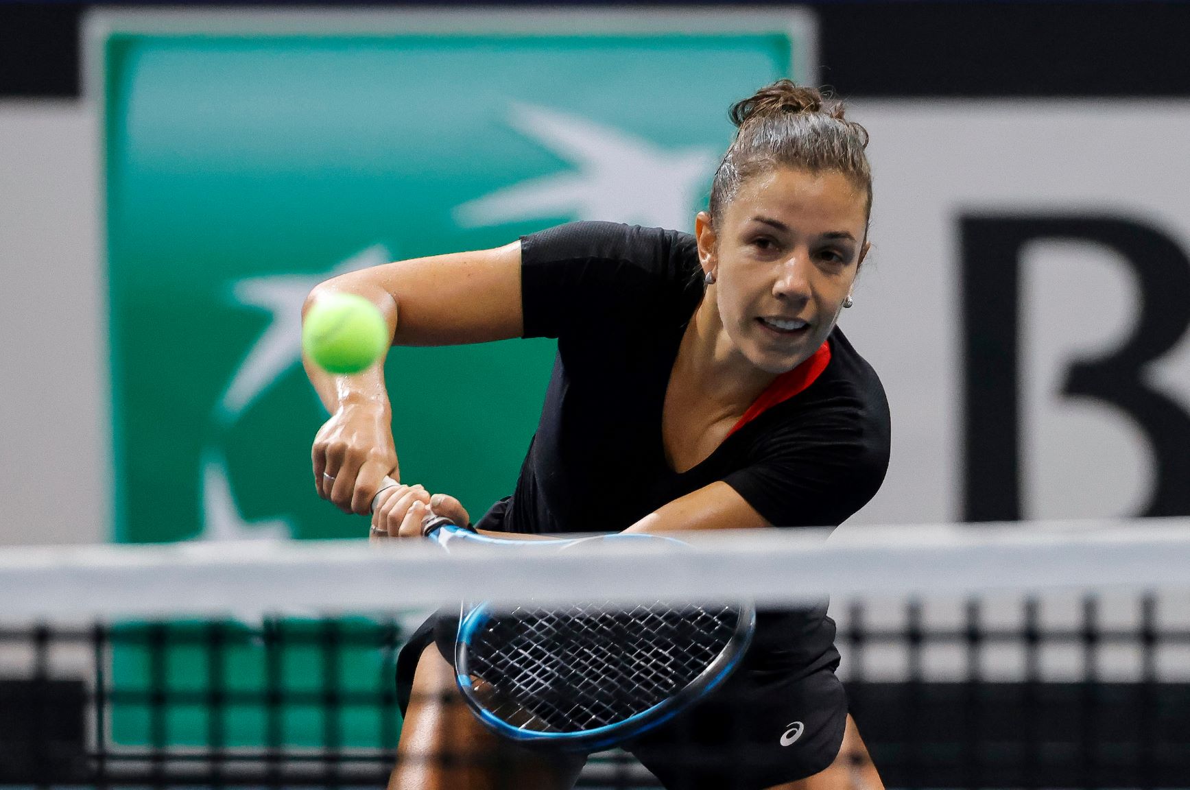 Sharon Fichman hits a backhand at the net