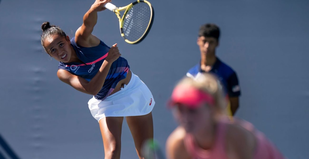 Fernandez serving partner Routcliffe at net