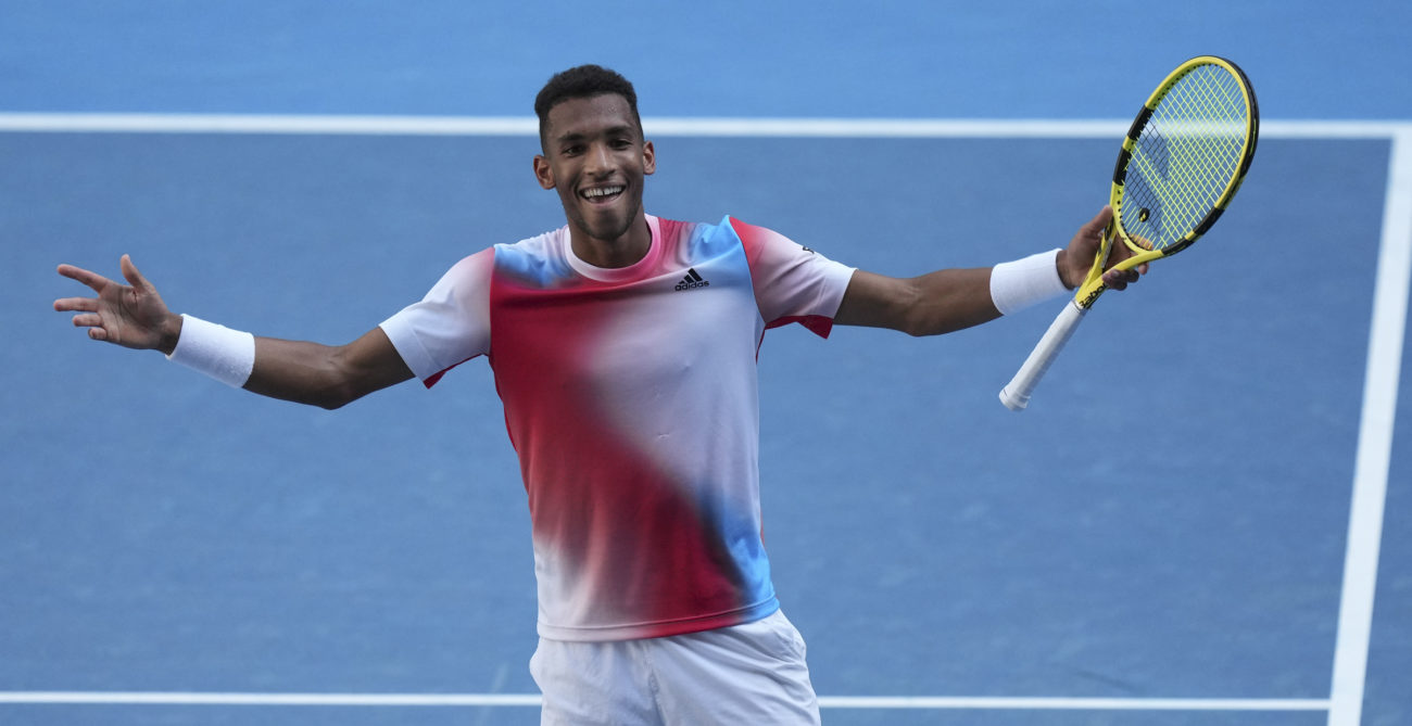 felix auger-aliassime raised arms after australian open round 4 win