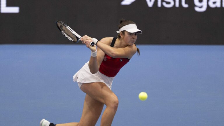 Marina Stakusic follows through on a backhand.