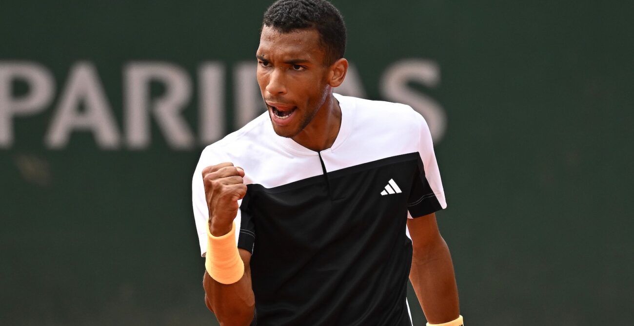 Felix Auger-Aliassime pumps his fist during his second-round win at Roland-Garros. He and Denis Shapovalov both won on Thursday.