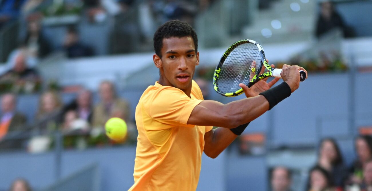 Felix Auger-Aliassime winds up to slice a backhand. He lost to Andrey Rublev in the Madrid final.