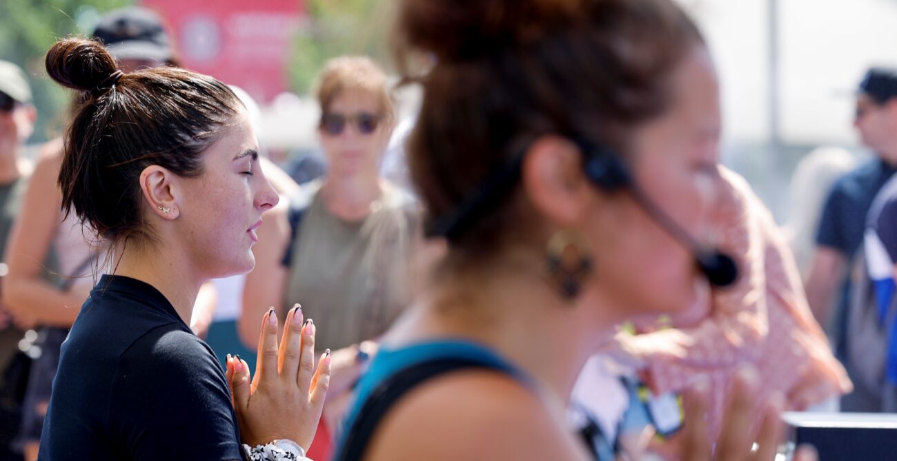 Bianca Andreescu (left) closes her eyes and meditates during a yoga session designed to help with stress and anxiety.