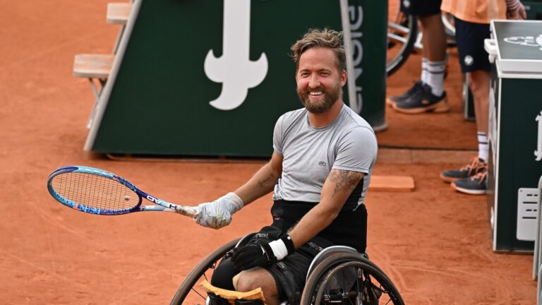Rob Shaw smiles during his wheelchair singles match at the French Open. He will be competing at the Paralympics in July.