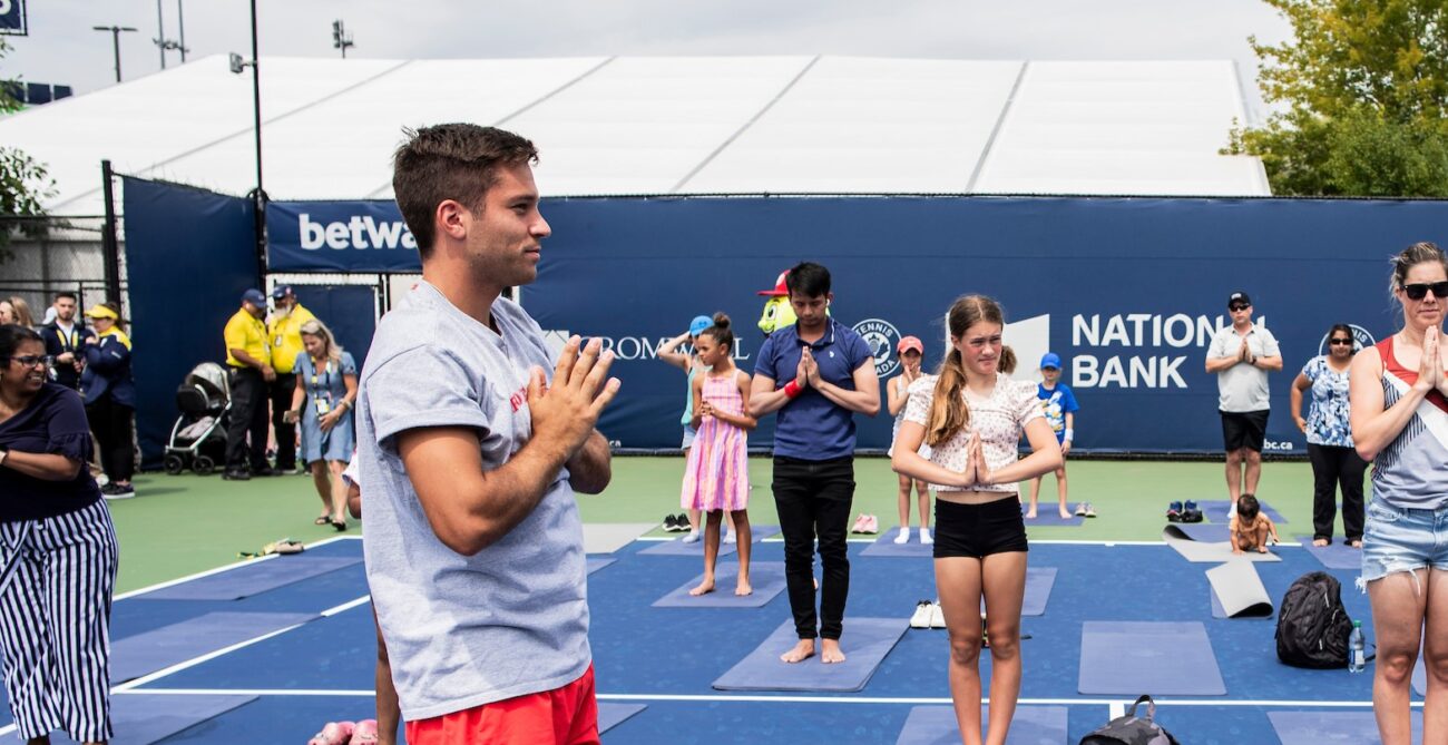 Alexis Galarneau does a yoga pose as part of the Mental Timeout yoga at the National Bank Open.