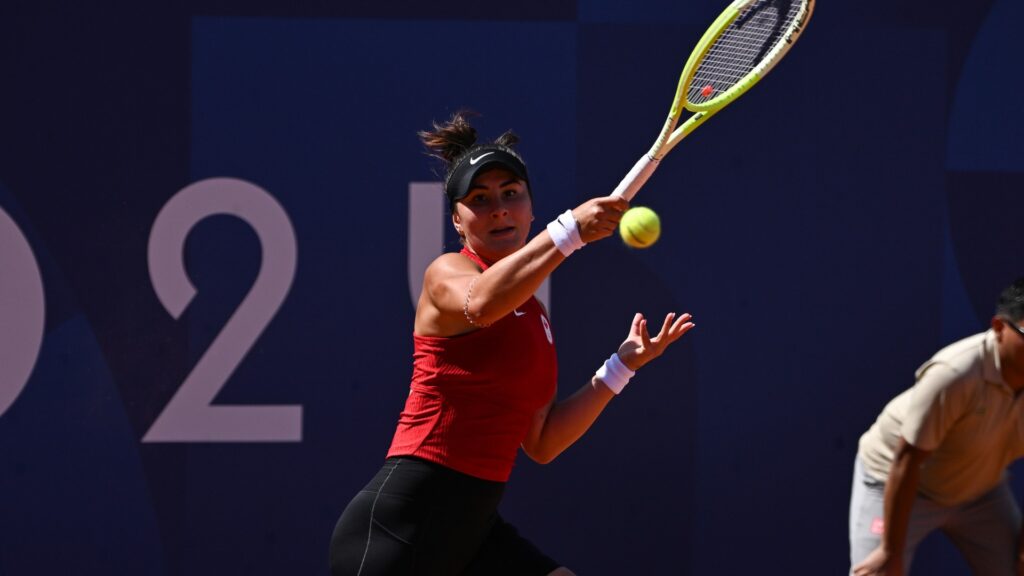 Bianca Andreescu follows through on a forehand during her win over Clara Tauson in her Olympic debut.