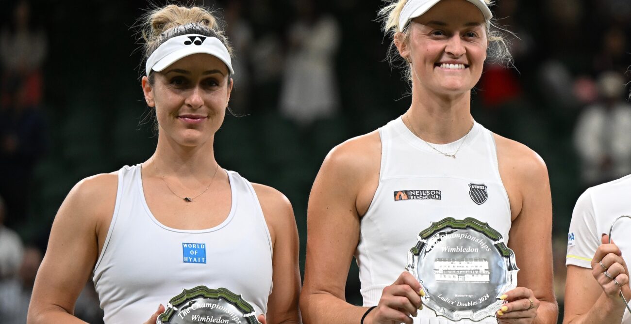 Gabriela Dabrowski (right) and Erin Routliffe hold up their runner-up trophies at Wimbledon. Dabrowski was the only player from Canada left in week two of the Championships.