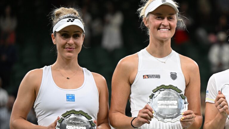 Gabriela Dabrowski (right) and Erin Routliffe hold up their runner-up trophies at Wimbledon. Dabrowski was the only player from Canada left in week two of the Championships.