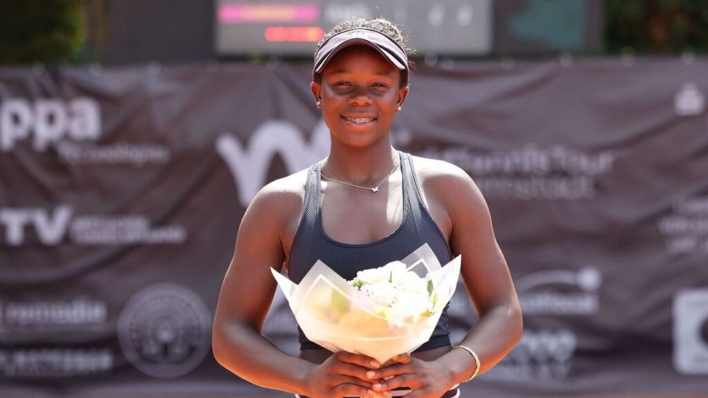 Victoria Mboko holds up her trophy and smiles to the camera. She was one of many Canadians to win last week on the ITF Tour.
