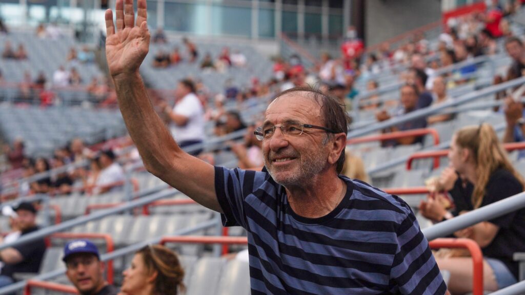 Louis Borfiga waves to the crowd in Montreal. He will be inducted into the Canadian Tennis Hall of