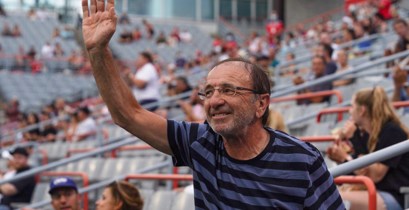 Louis Borfiga waves to the crowd in Montreal. He will be inducted into the Canadian Tennis Hall of Fame this summer.