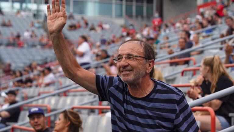 Louis Borfiga waves to the crowd in Montreal. He will be inducted into the Canadian Tennis Hall of Fame this summer.