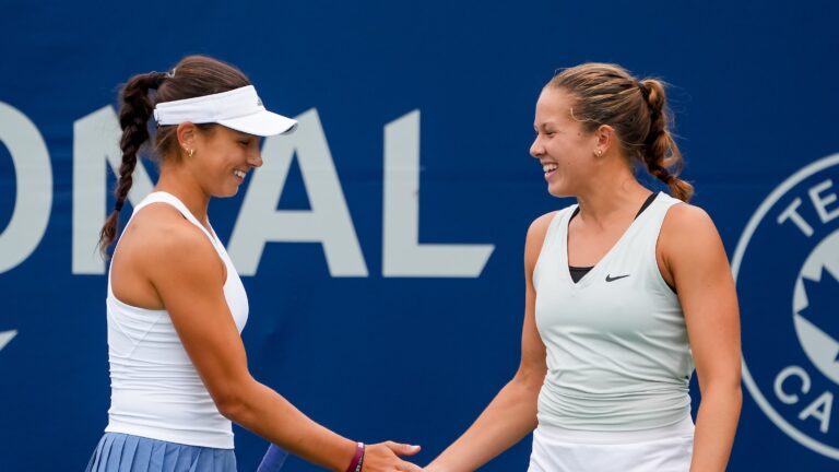 Mia Kupres (left) and Ariana Arseneault high-five. They are competing at a Canadian ITF event this week in Saskatoon.