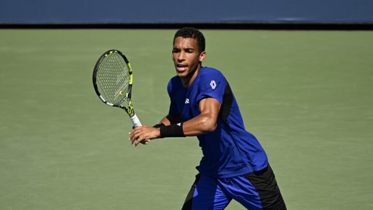 Felix Auger-Aliassime prepares to chase down a forehand. He and Denis Shapovalov were eliminated from the US Open on Tuesday.