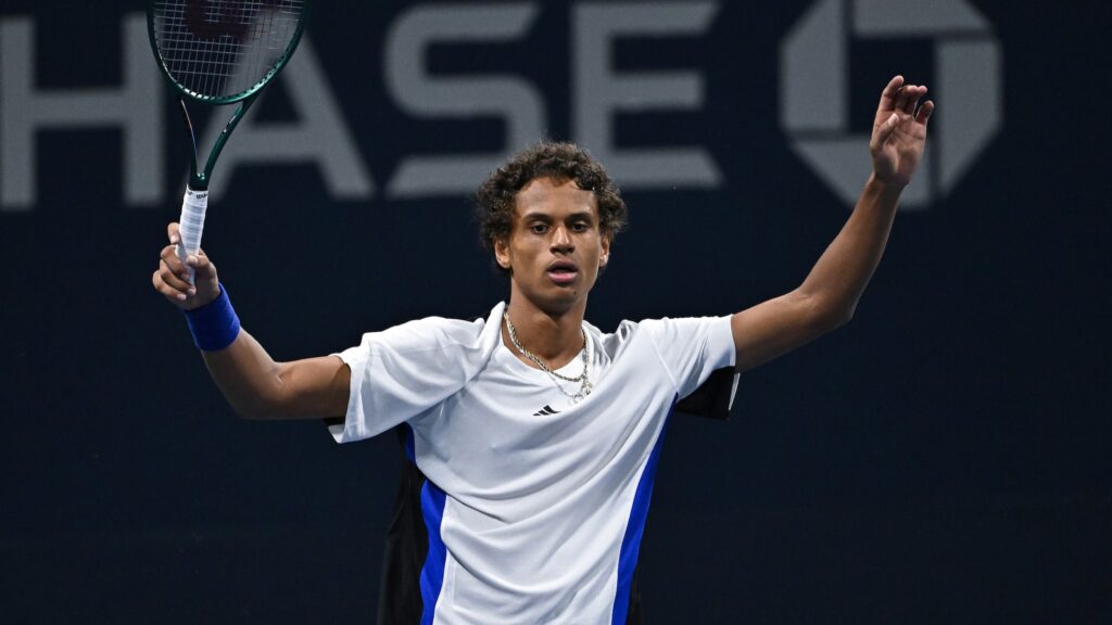 Gabriel Diallo raises his arms in celebration at the US Open. Gabriela Dabrowski also beat Leylah Fernandez in the doubles.