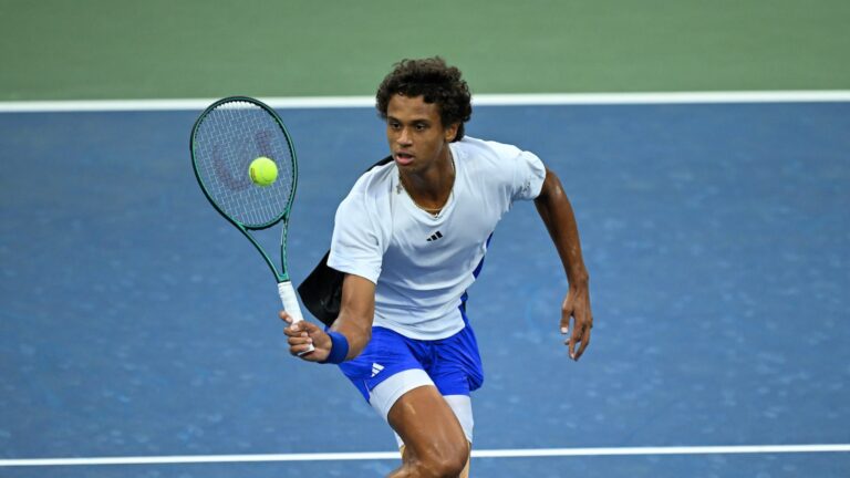 Gabriel Diallo hits a forehand volley. His run at the US Open came to an end in round three against Tommy Paul,