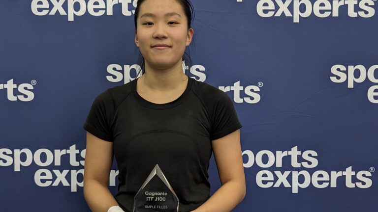 Emma Dong holds up a trophy. She and Nadia Lagaev are the top Canadians in Repentigny this week.