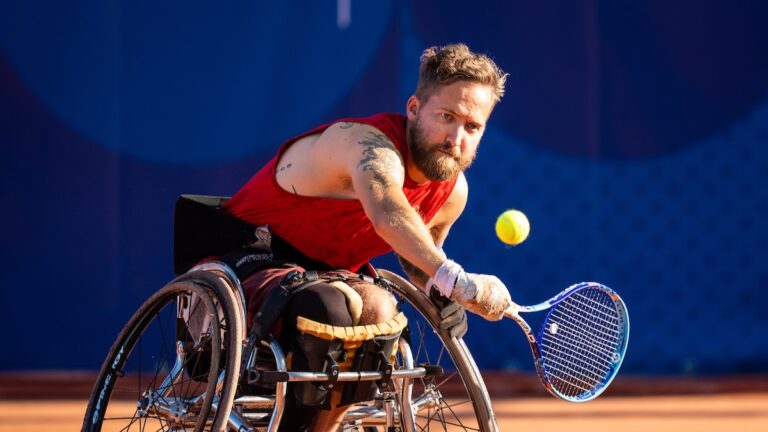 Rob Shaw hits a backhand. He advanced to the quarter-finals of the 2024 Paralympic wheelchair tennis event in Paris.