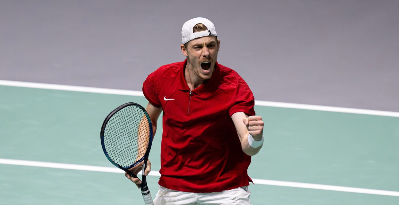 Denis Shapovalov pumps his fist. He sent Canada back to the Davis Cup Final 8 with a win over Britain and Dans Evans.