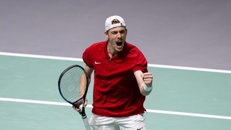 Denis Shapovalov pumps his fist. He sent Canada back to the Davis Cup Final 8 with a win over Britain and Dans Evans.