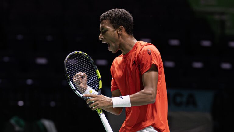 Felix Auger-Aliassime pumps his fist and yells as Canada defeated Argentina at the Davis Cup.