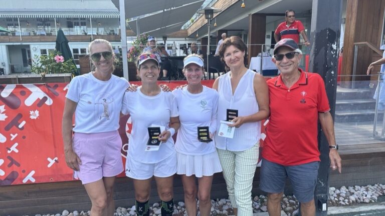 Several champions pose with their trophies at the 2024 Steven Stevens Masters Tennis Championships.