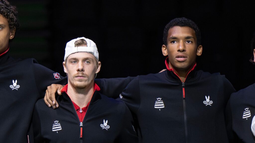 Denis Shapovalov and Felix Auger-Aliassime stand together during the national anthem at the Davis Cup.