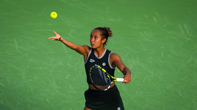 Leylah Fernadnez tosses the ball up to serve. She lost to Qinwen Zheng on Thursday in Wuhan.