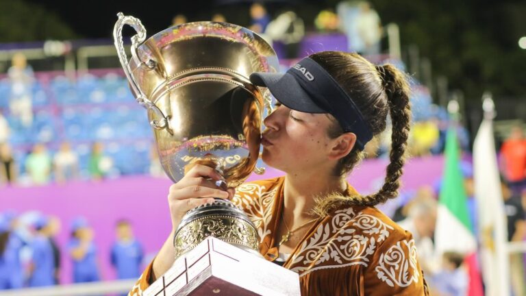 Marina Stakusic kisses the trophy in Tampico, Mexico.