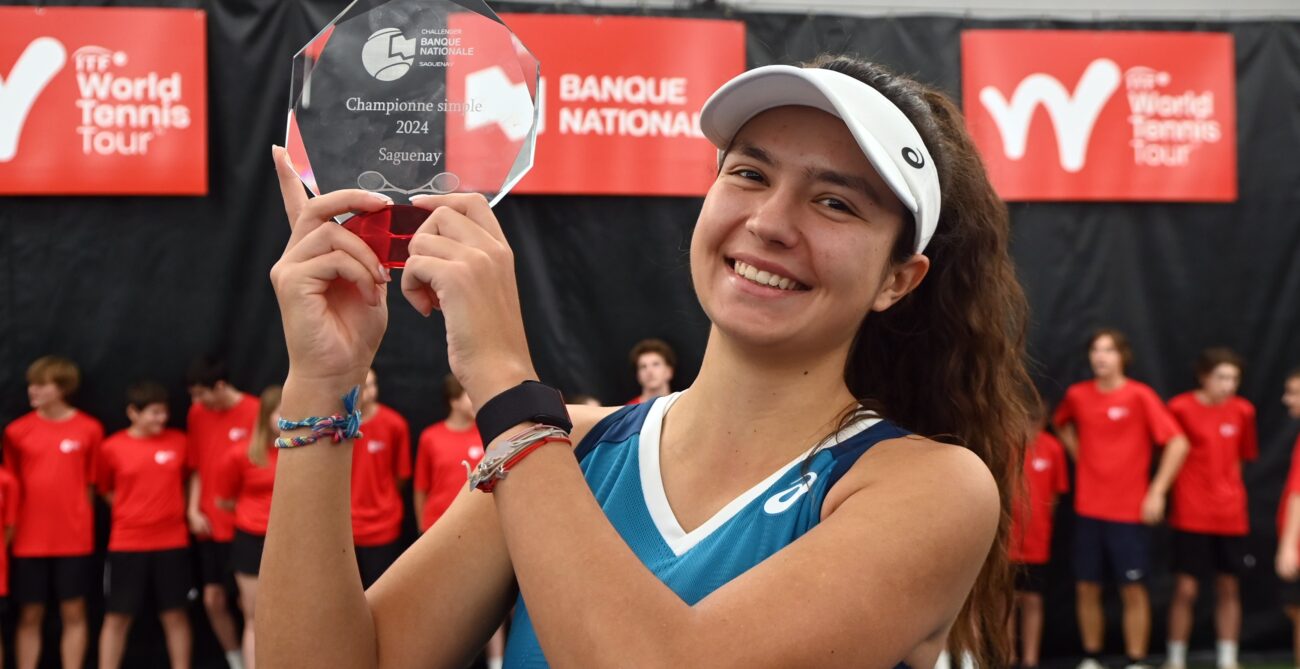 Petra Marcinko holds up her champions trophy in Saguenay.