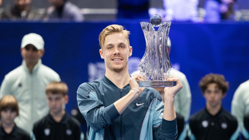 Denis Shapovalov holds up the trophy in Belgrade after beating Hamad Medjedovic.