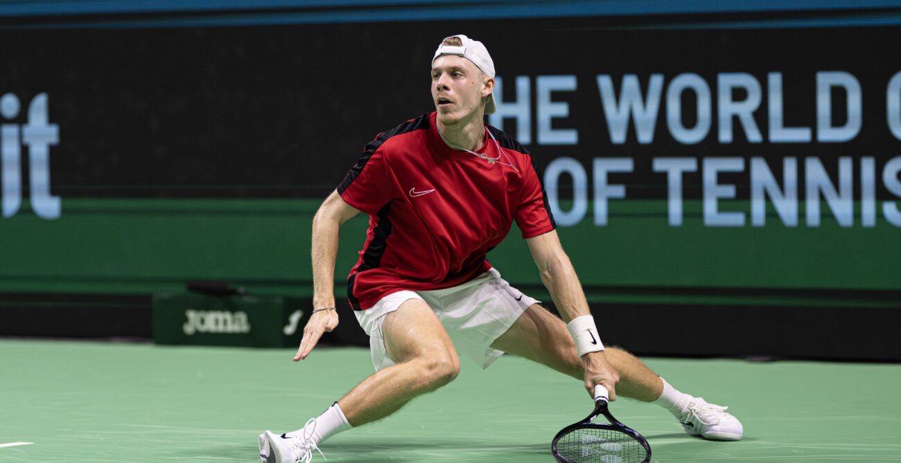 Denis Shapovalov slides after hitting a shot during Canada's Davis Cup loss to Germany.