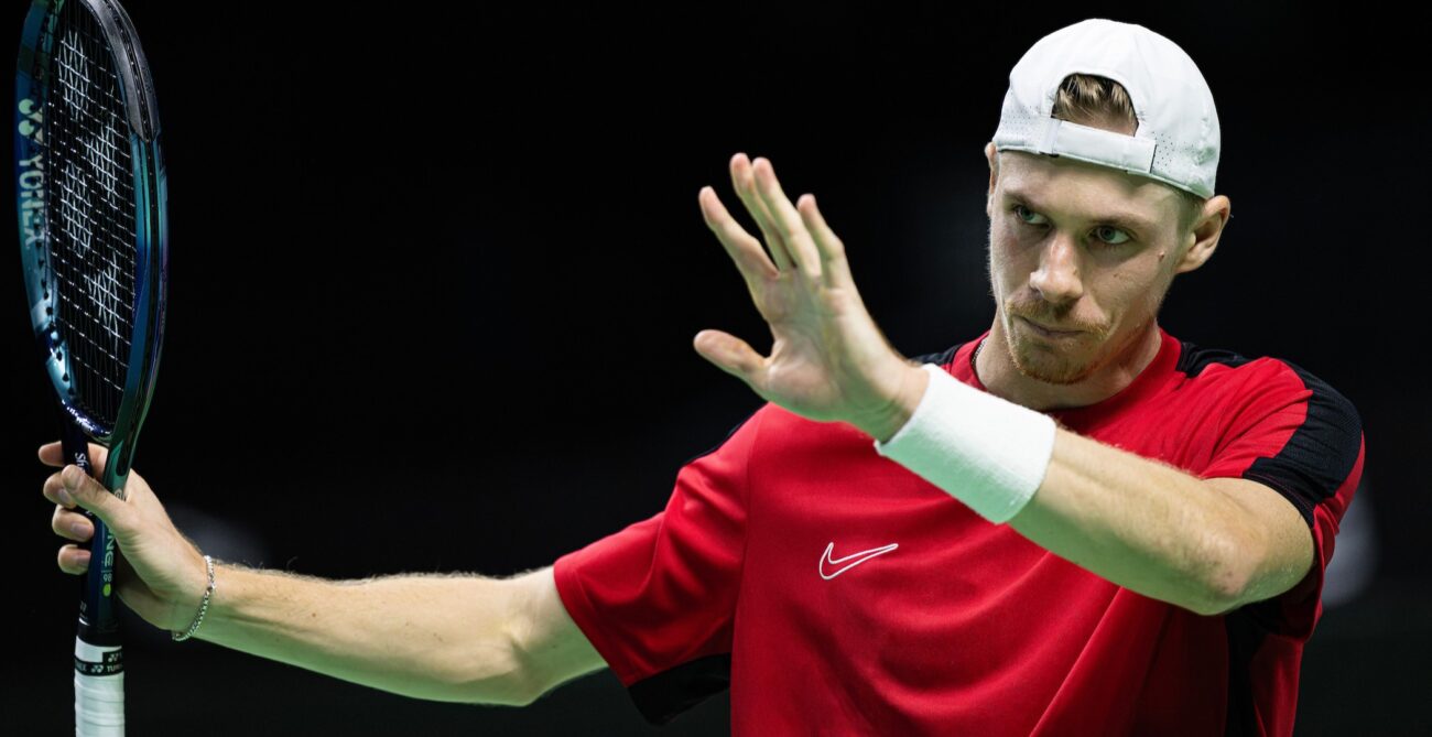 Denis Shapovalov raises his arms to acknowledge a mishit during Canada's quarter-final loss in Malaga.