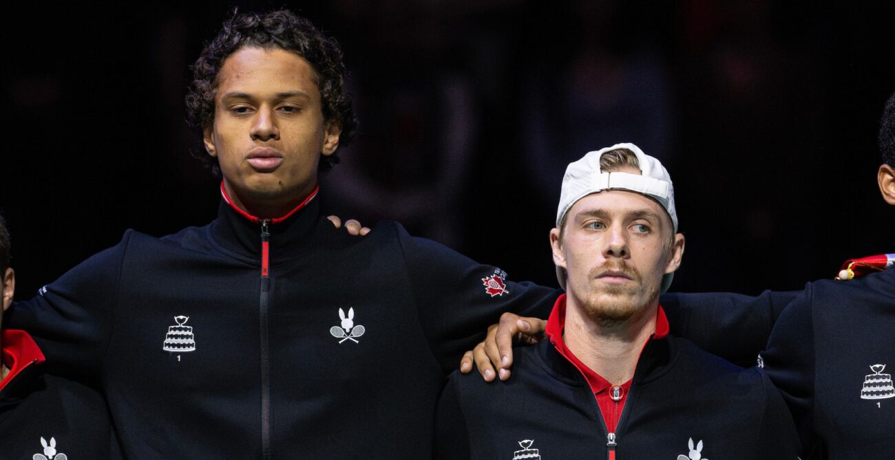 Gabriel Diallo (left) and Denis Shapovalov (right) stand in line before a match at the Davis Cup in Manchester.