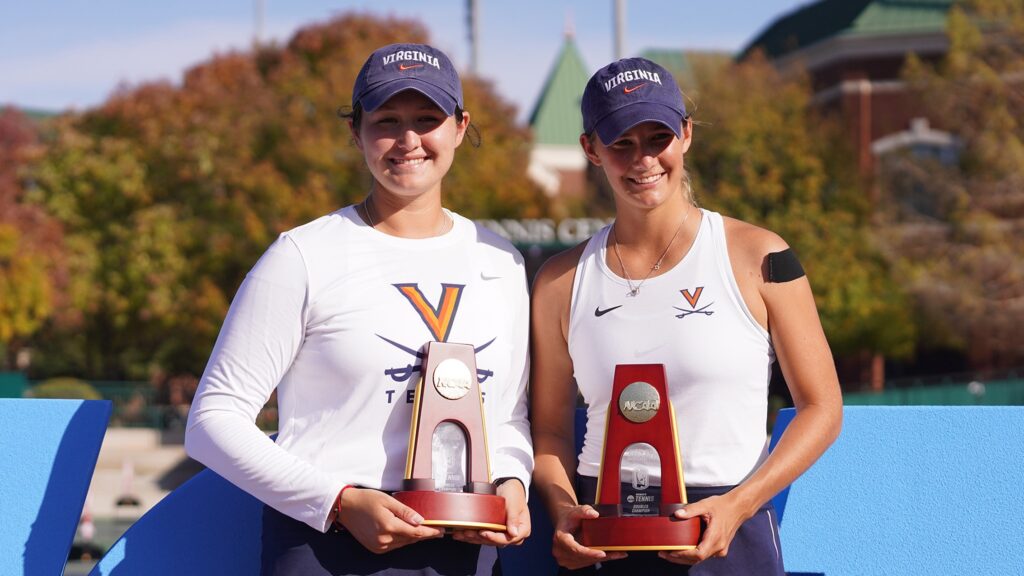 Elaine Chervinsky (left) and Melodie Collard (right) hold their trophies after winning the NCAA national doubles title.