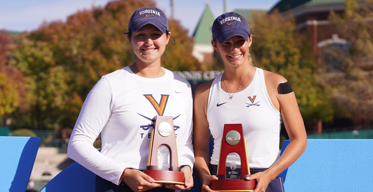 Elaine Chervinsky (left) and Melodie Collard (right) hold their trophies after winning the NCAA national doubles title.