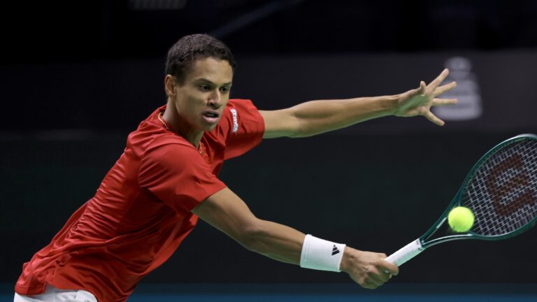 Gabriel Diallo lunges for a backhand volley during the opening match of the Davis Cup quarter-final between Canada and Germany.