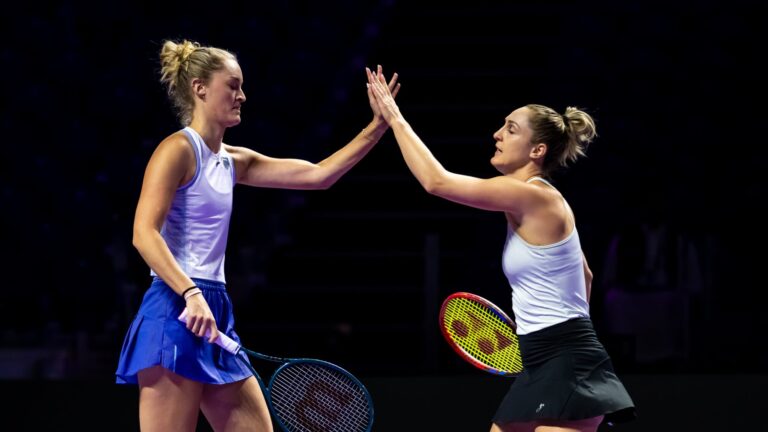 Gabriela Dabrowski and Erin Routliffe high five at 2024 WTA Finals