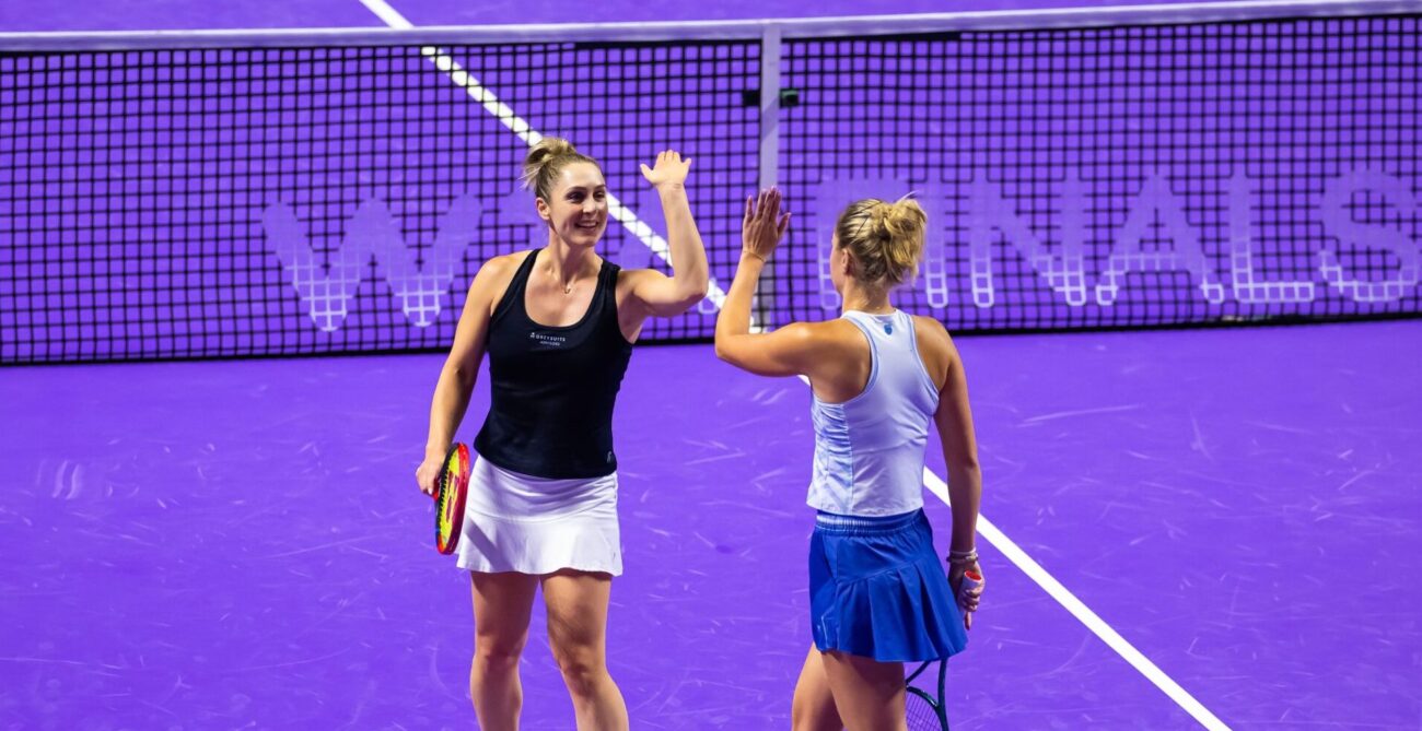 Gabriela Dabrowski and Erin Routliffe high five at 2024 WTA Finals