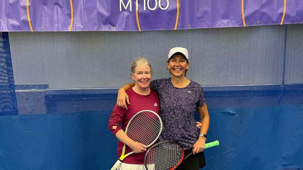 Two Canadians pose on court at the ITF Masters event in Bedford, NS.