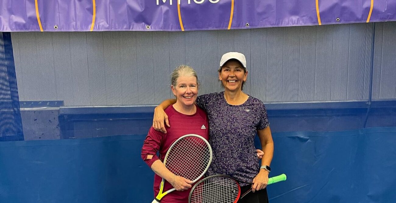 Two Canadians pose on court at the ITF Masters event in Bedford, NS.