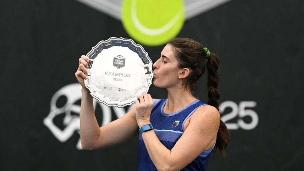 Rebecca Marino kisses a trophy. She was one of five Canadians to win titles in what was the best week for Canadian tennis in 2024.