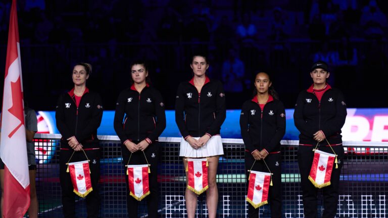 Canada's Billie Jean King Cup team (from left to right, Gabriela Dabrowski, Marina Stakusic, Rebecca Marino, Leylah Annie Fernandez, Heidi El Tabakh) stand on court ahead of their quarter-final tie with Great Britain.