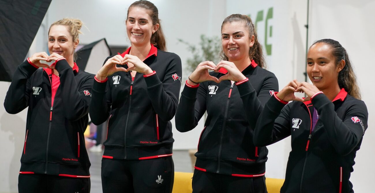 Team Canada (from left to right, Gabriela Dabrowski, Rebecca Marino, Marina Stakusic, Leylah Annie Fernandez) all make heart shapes with their hands.