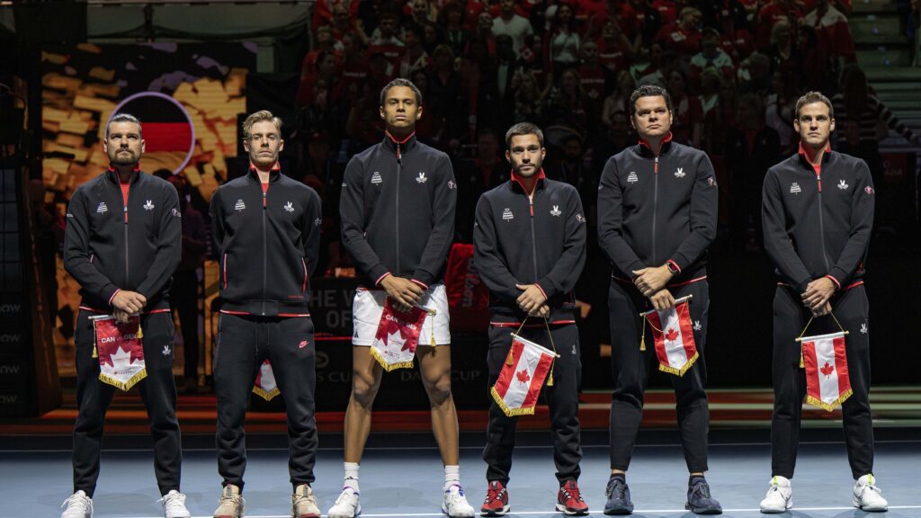 From left to right: Frank Dancevic, Denis Shapovalov, Gabriel Diallo, Alexis Galarneau, Milos Raonic, and Vasek Pospisil stand on court during the pre-tie ceremony at the World Cup of Tennis, Davis Cup Final 8.