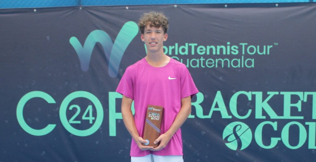 Xavier Massotte stands with his trophy in Guatemala.