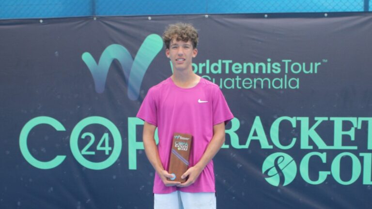 Xavier Massotte stands with his trophy in Guatemala.