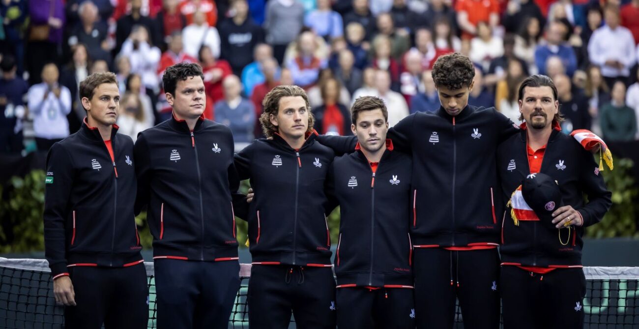 The members of Team Canada (from left to right: Vasek Pospisil, Milos Raonic, Liam Draxl, Alexis Galarneau, Gabriel Diallo, Frank Dancevic) stand on court in Montreal ahead of their 2024 Davis Cup qualifier tie.