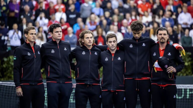 The members of Team Canada (from left to right: Vasek Pospisil, Milos Raonic, Liam Draxl, Alexis Galarneau, Gabriel Diallo, Frank Dancevic) stand on court in Montreal ahead of their 2024 Davis Cup qualifier tie.