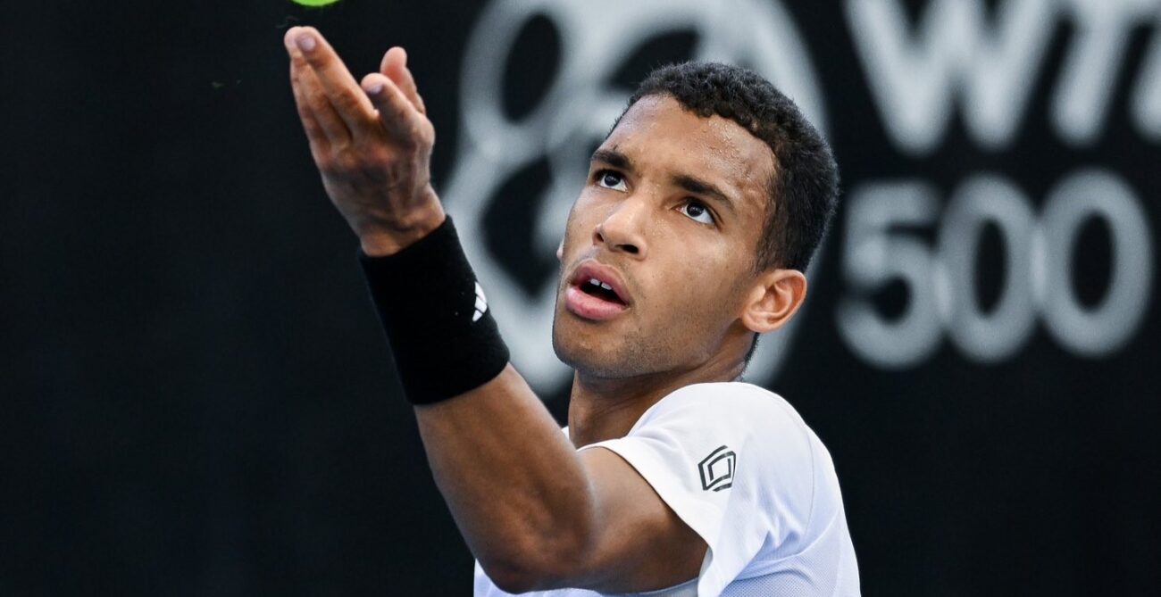 Felix Auger-Aliassime tosses a ball up to serve in Adelaide. He beat Marcos Giron in the quarter-finals on Thursday.